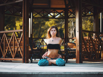 Portrait of young woman practicing yoga