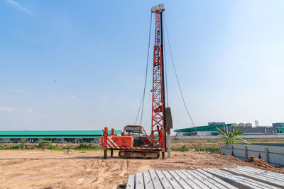 Piling machines installed piles at a construction site for a new building.