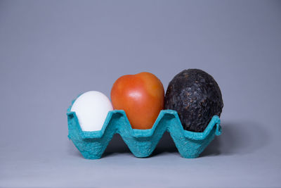 Close-up of eggs against white background