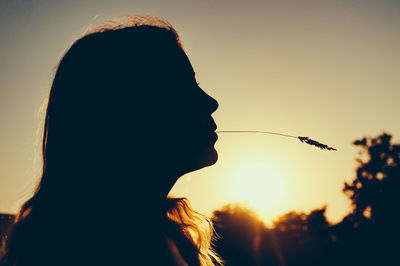 View of woman against sunset