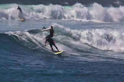 Man surfing on sea