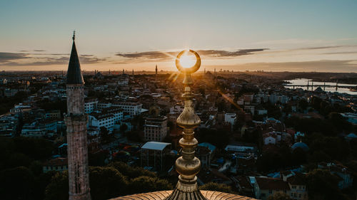 Aerial view of city buildings during sunset