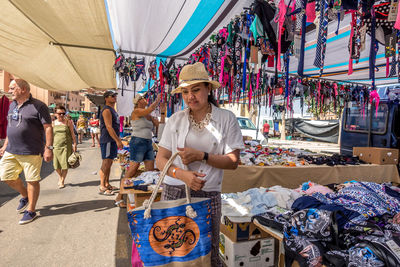 Group of people at market stall