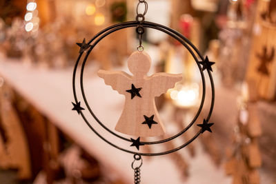 Close-up of decoration hanging on metal