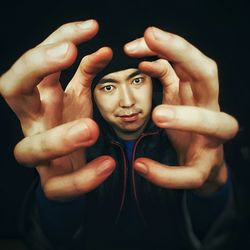 Portrait of young man gesturing