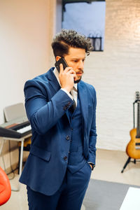 Mid adult man using mobile phone
