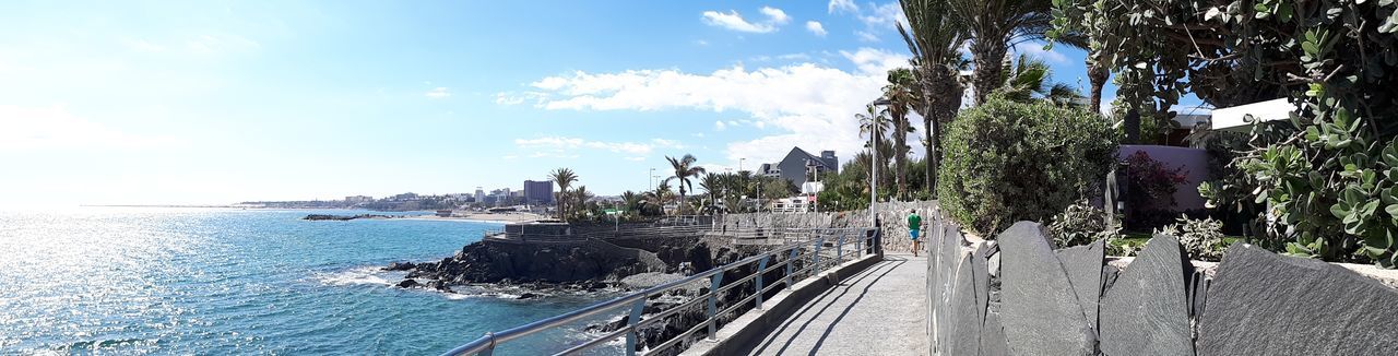 sky, cloud - sky, sea, day, tree, outdoors, built structure, architecture, sunlight, nature, no people, building exterior, water, scenics, panoramic, beauty in nature