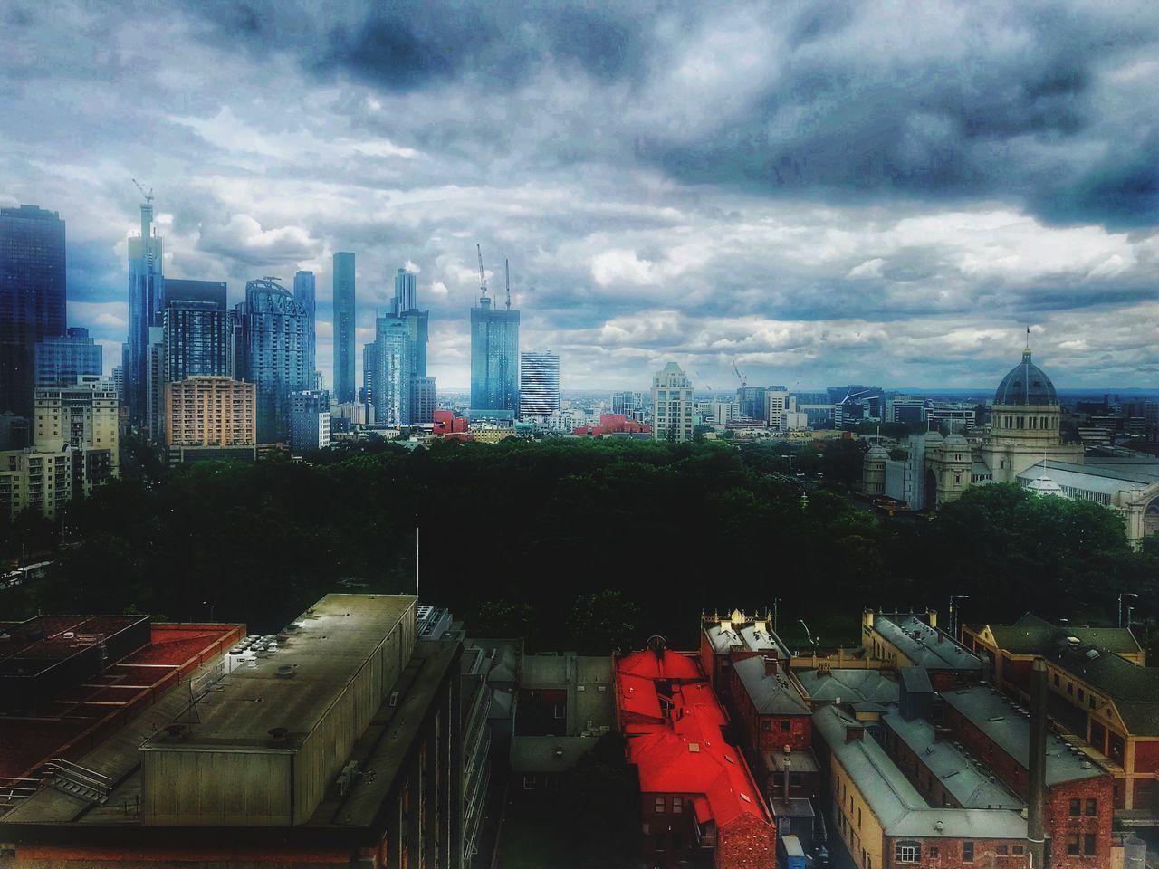 HIGH ANGLE VIEW OF BUILDINGS AGAINST SKY