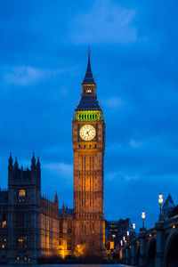 Illuminated big ben against sky at dusk