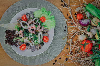 High angle view of fruit salad in plate on table