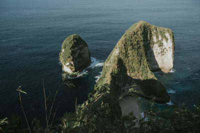 High angle view of rocks by sea