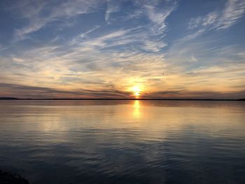 Scenic view of sea against romantic sky at sunset