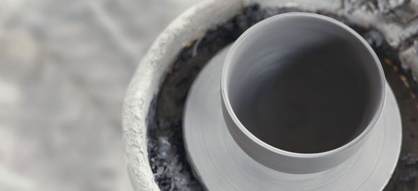 High angle view of coffee cup on metal