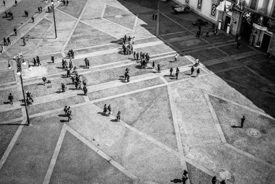 High angle view of people walking on street in city