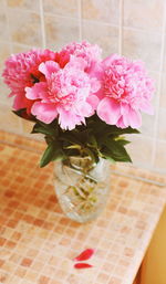 High angle view of pink flower vase on table