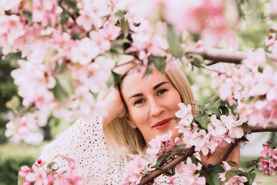 Portrait of young woman with flowers