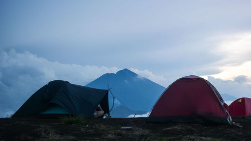 Scenic view of tent on mountain against sky