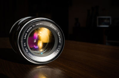 Close-up of camera on table