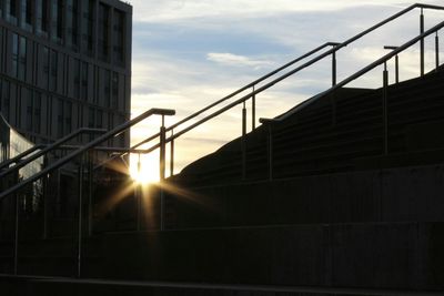 Low angle view of built structure against sunset sky