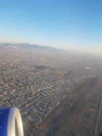 Aerial view of cityscape against sky