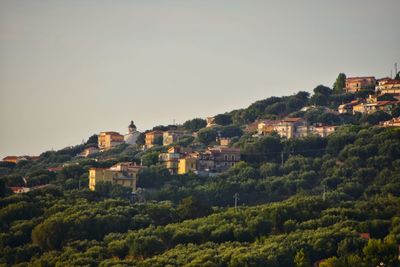 Buildings in city against sky