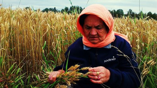 Portrait of mature man standing in field