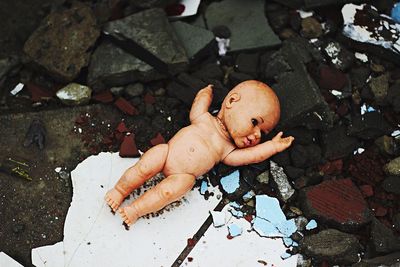 High angle view of abandoned doll on construction site