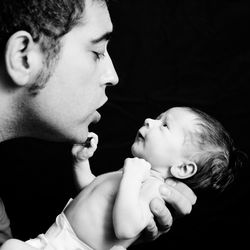 Close-up of father holding baby