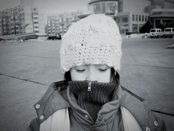 Woman wearing hat in city