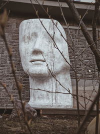 Close-up of painting on fence against plants