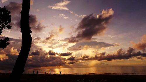 Scenic view of sea against cloudy sky