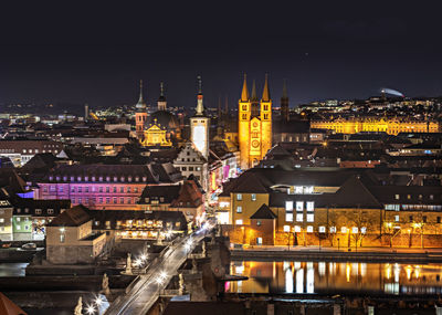 Illuminated buildings in city at night