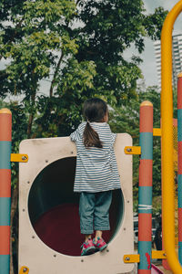 Little girl playing at the playground.