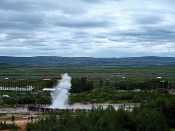 Scenic view of landscape against cloudy sky