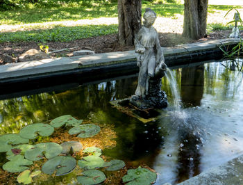 Statue of fountain in lake