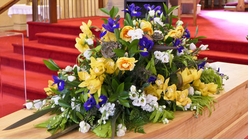 Close-up of multi colored flowers on table