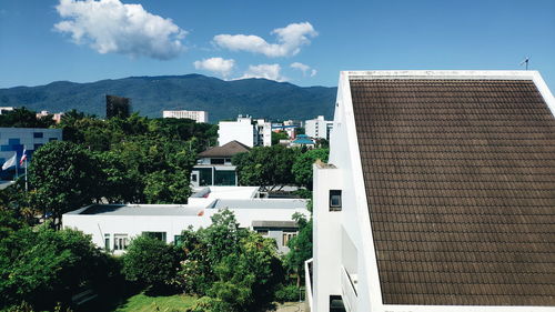Buildings in town against sky