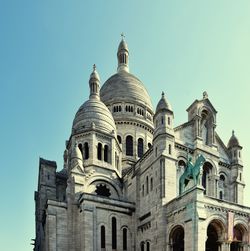 Low angle view of basilique du sacre coeur against clear blue sky