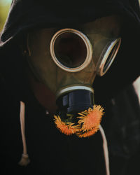 Close-up of person with gas mask