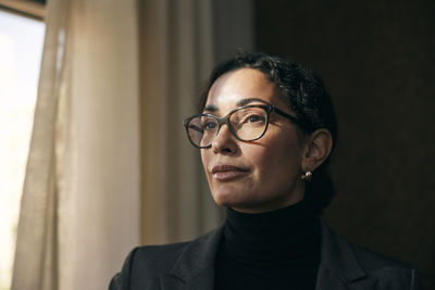 Portrait of young man against wall