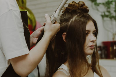 Portrait of a young girl at the hairdresser.