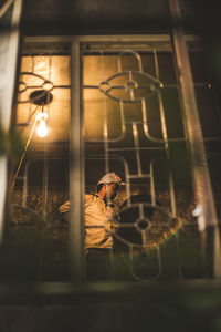 Reflection of man on window