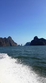 Scenic view of beach against blue sky