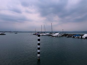 Sailboats on sea against sky