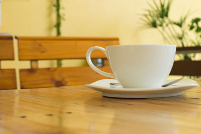 Close-up of cup on table