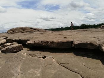 Scenic view of rocks on land against sky