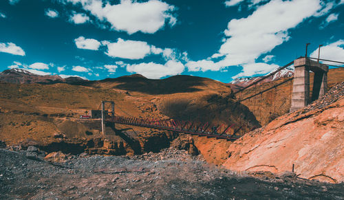 View of bridge against cloudy sky