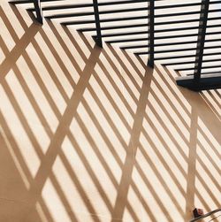 High angle view of chairs on floor during sunny day