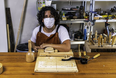 Sculptress with mask carving wooden box