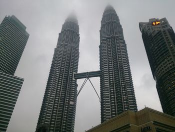 Low angle view of skyscrapers against sky